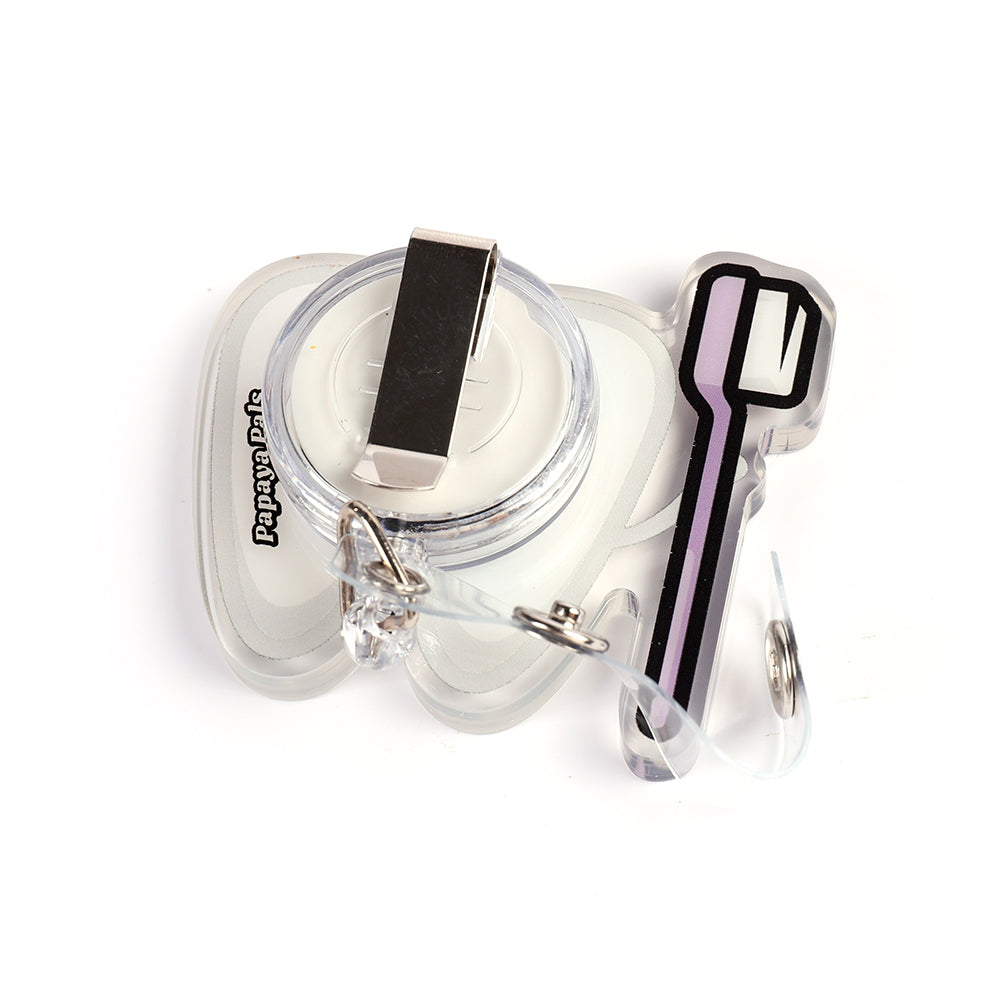 Back of the Bright Smiles shaker badge reel showing the standard badge clip attachment.