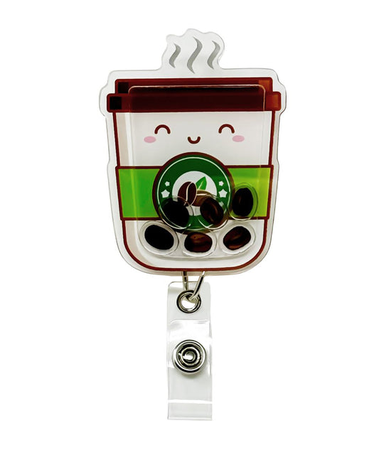 Caffeine Cutie shaker badge reel by Papaya Pals, adorned with a cute coffee-themed design and tiny shaker elements inside a clear casing, ideal for caffeine enthusiasts who want to showcase their love for coffee at work.