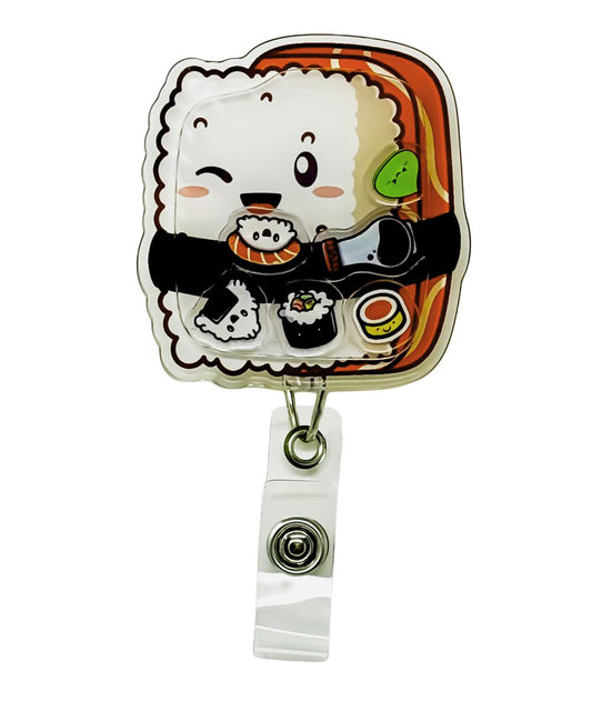 Irrashaimase shaker badge reel by Papaya Pals, featuring a salmon nigiri theme with playful shaker elements inside a clear casing, perfect for those who love sushi and want to bring a warm, inviting touch to their work attire.