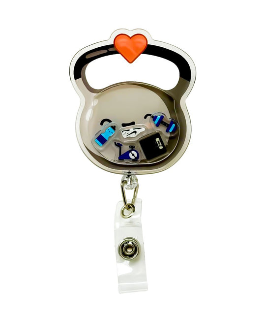 Kettle Belle shaker badge reel by Papaya Pals, featuring a fitness-inspired design with a playful kettlebell charm and shaker elements inside a clear casing, perfect for fitness enthusiasts who want to add some flair to their workday.