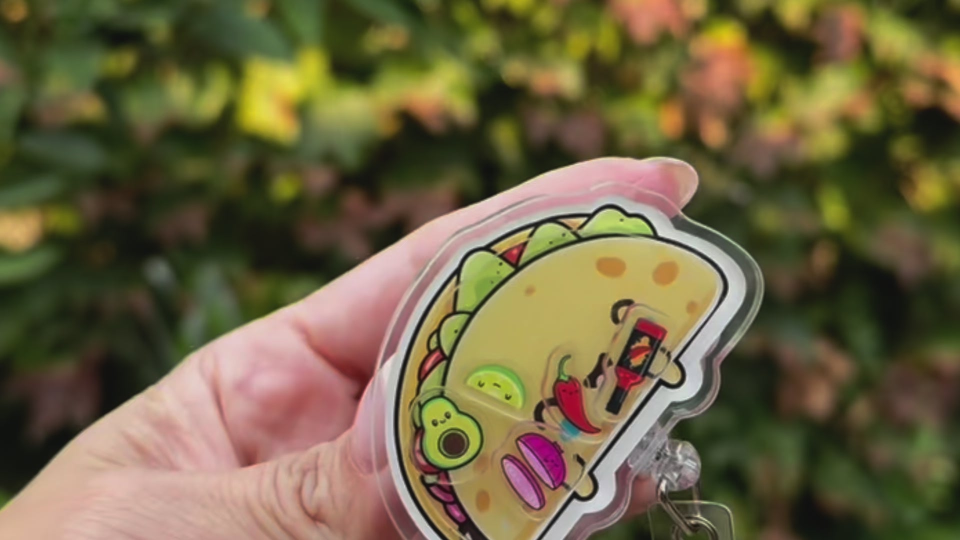 Load video: Video of different Papaya Pals shaker badge reels being shaken.